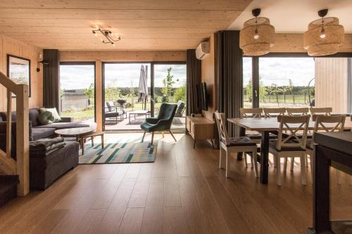 a living room with a table and a dining room at Siema Siemiany in Siemiany