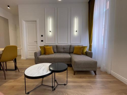a living room with a couch and a table at Central Apartments Sarajevo in Sarajevo