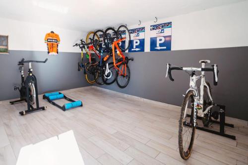a room with two bikes hanging on a wall at Casa Charlie in Arcisate