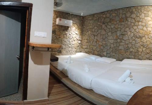 Ένα ή περισσότερα κρεβάτια σε δωμάτιο στο SKYROCK VILLA