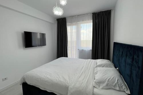 Un pat sau paturi într-o cameră la Villa in Domnești