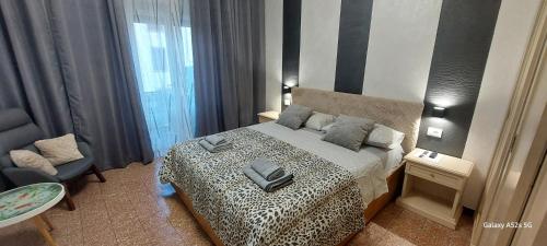 Postel nebo postele na pokoji v ubytování NATALI Appartamens