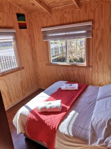 Voodi või voodid majutusasutuse Sol de la Patagonia Bahía Murta toas