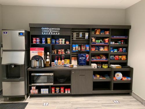 a coffee shop with a counter and a refrigerator at Candlewood Suites - Lebanon by IHG in Lebanon