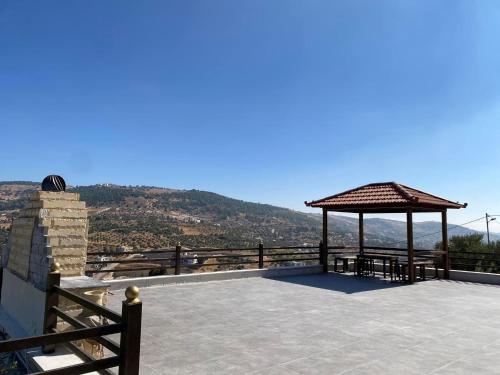 a pavilion with a gazebo on top of a building at Souf view in Jerash