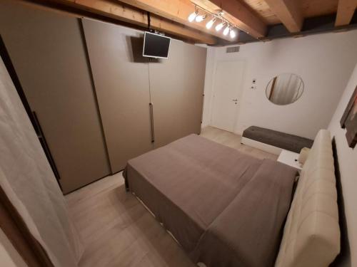 a small room with a bed and a couch at Central Luxury Garden guest house in Mestre