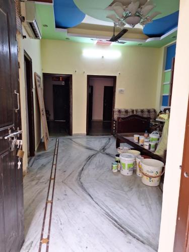a living room being remodeled with a ceiling at Double bedroom furnished home long stay in Hyderabad