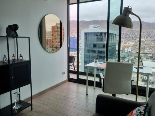 a living room with a view of a city at Antofagasta Inolvidable-SOLO ADULTOS in Antofagasta