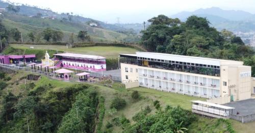 an aerial view of a building on a hill at Hotel Entre Lomas in Santa Rosa de Cabal