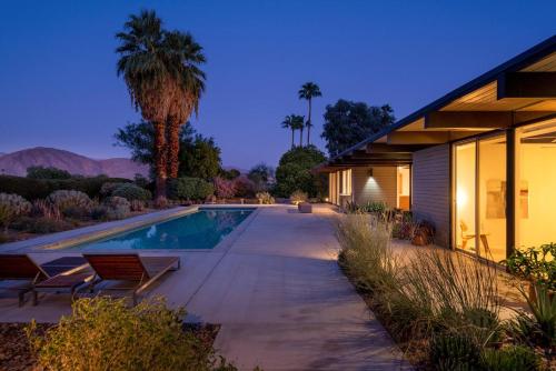 a home with a swimming pool and a house at The Milky Way Modern Desert Retreat in Borrego Springs