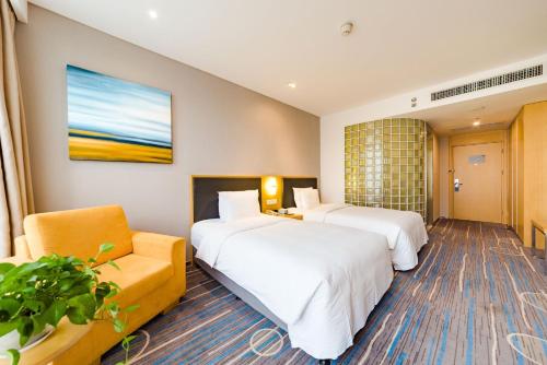 Postel nebo postele na pokoji v ubytování Holiday Inn Express Shijiazhuang Heping by IHG
