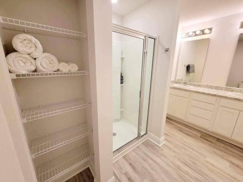 a bathroom with a shower and a walk in shower at Brand NEW house in Pensacola EV connector included in Pensacola
