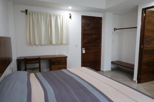 Katil atau katil-katil dalam bilik di Solez Zihuatanejo
