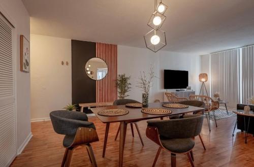 a living room with a dining room table and chairs at Tides Condominiums in Hollywood