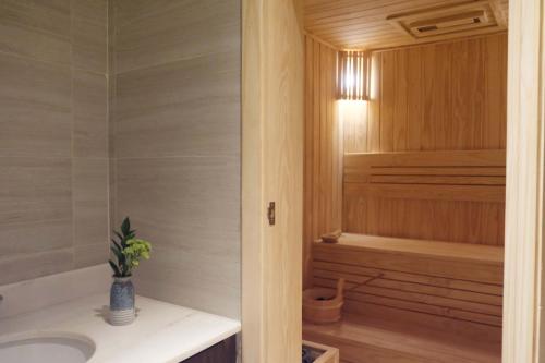 a bathroom with a sink and a bath tub at Crowne Plaza Vinh Yen City Centre by IHG in Yen