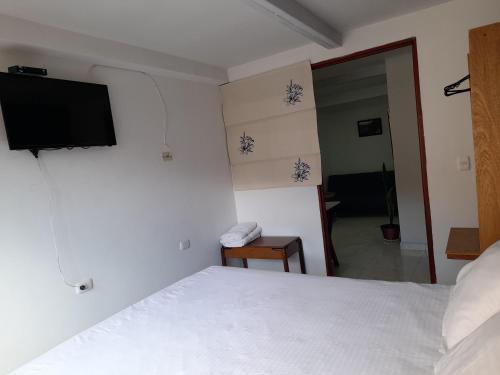 Ένα ή περισσότερα κρεβάτια σε δωμάτιο στο Alojamiento Casa de T