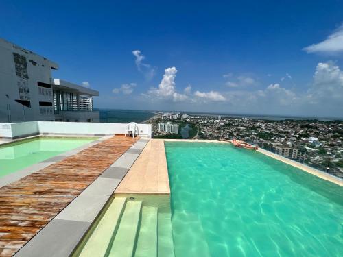 a swimming pool on the roof of a building at Cartagena Seaview Elegance in Cartagena de Indias