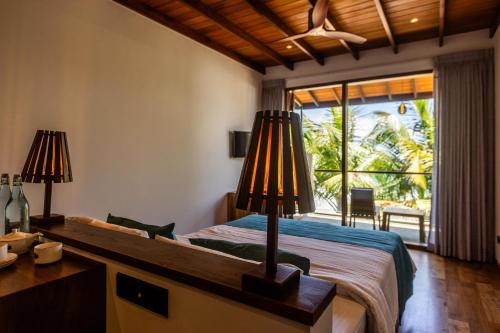 Voodi või voodid majutusasutuse BK Beach Boutique Hotel - Hikkaduwa toas