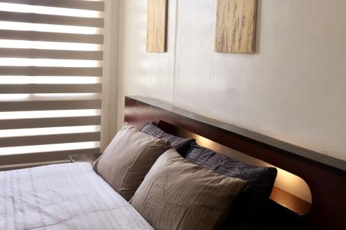 A bed or beds in a room at Contemporary 2BR w/Parking at Marquee Residences