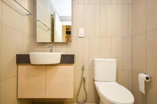 a bathroom with a toilet and a sink at Afiniti Theme Suite by Nest Home【LEGOLAND】 in Nusajaya