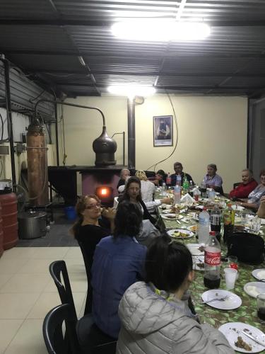 a group of people sitting at a table eating at Eleni Apartments in Hersonissos