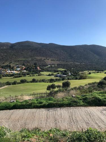 a view of a golf course from a field at Eleni Apartments in Hersonissos