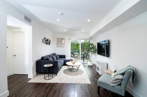 a living room with a couch and a table at Luxury 2Bed/2Bath Apt in West Hollywood w/ Rooftop in Los Angeles