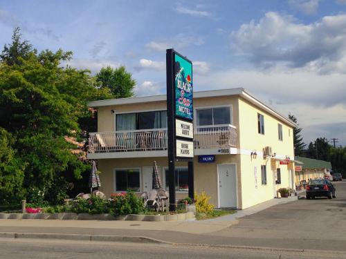 a building with a sign in front of it at Black Sea Motel in Penticton