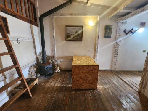 a room with a table in the middle of a room at Biktot Ba Arafel in Nimrod