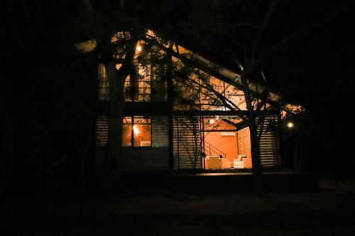 a house lit up at night in the dark at Life of Leisure Wilpattu in Pahala Maragahawewa