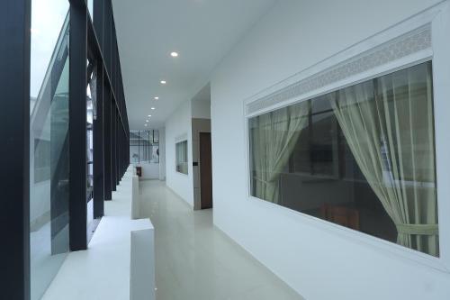 an empty hallway of a building with windows at Hotel Dream Suite, Kattappana in Kattappana