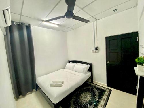 מיטה או מיטות בחדר ב-Sukay Homestay