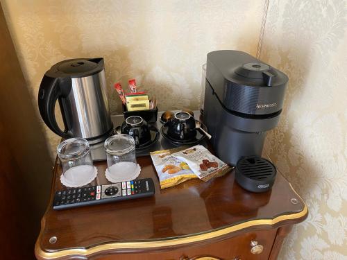 a coffeemaker and coffee maker on a table at B&B Ca' Bonvicini in Venice