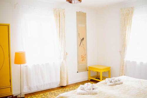 a bedroom with two beds with towels on them at Landhaus am Schloss in Schnabelwaid