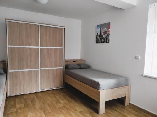 Postel nebo postele na pokoji v ubytování Apartmány Říčky