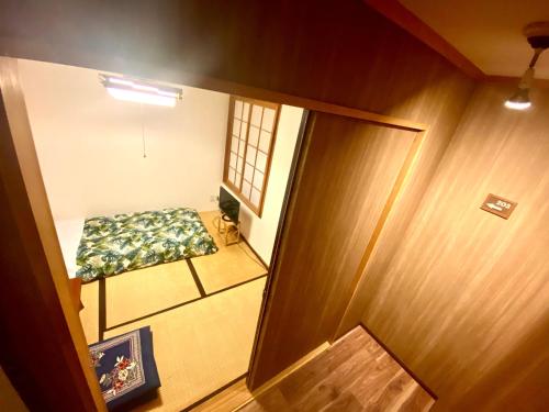 an overhead view of a room with a chair and a mirror at Grandpapa in Kutchan