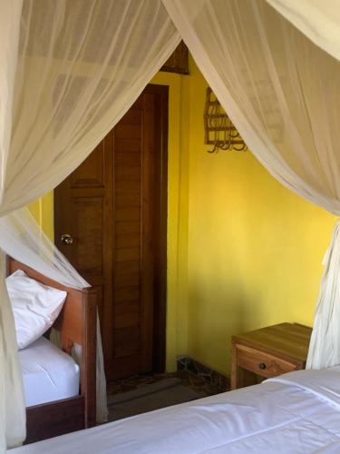Кровать или кровати в номере Jana's Homestay