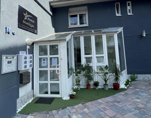 a greenhouse with plants in front of a building at Hotel Starlight in Frankfurt/Main