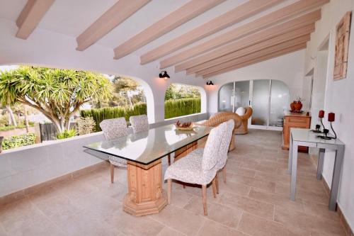 a dining room with a table and chairs at Apartments in a house in Jávea