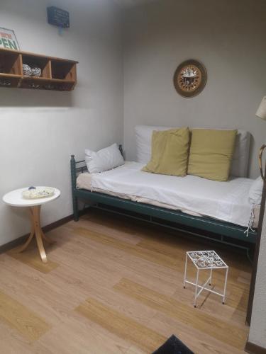 מיטה או מיטות בחדר ב-Angolo Nally