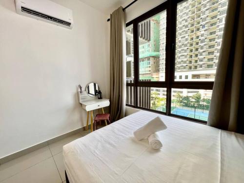 a bedroom with a bed and a desk and a window at New Condo Bali- 1BR/4Pax/2Carpark nr jonker encore in Melaka