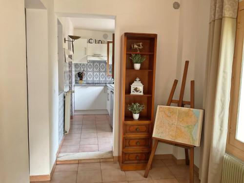 a hallway with a room with a table and a map at Douceur d'Azur in Nice