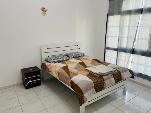 a bedroom with a bed and a nightstand next to a window at Al-Satwa Central Bliss: Ideal for Families in Dubai