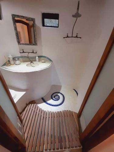 a bathroom with a sink and a sink at Half Moon Hollow Eco Cottage in Mossel Bay