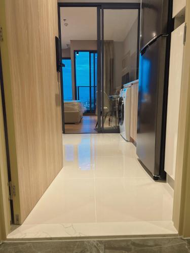 a view of a living room with a refrigerator at Once Pattaya Seaview Condo in Pattaya Central