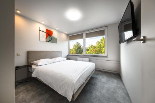 Postel nebo postele na pokoji v ubytování Berlin Studios