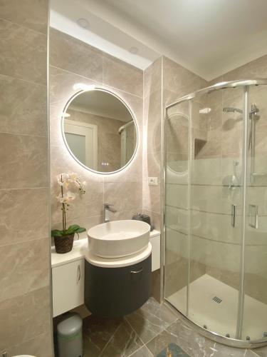 a bathroom with a toilet and a glass shower at Nido dei Cigni in Turin