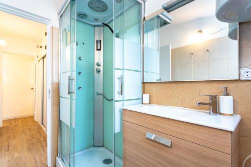 a bathroom with a sink and a shower at Casa da Ria by east ALgarve guest in Santa Luzia