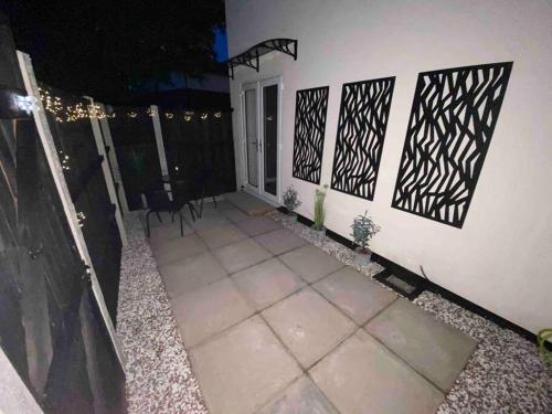 a screened in porch of a house at night at Modern 1 bed town centre apartment in Tamworth in Tamworth