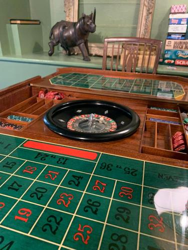 a table with a poker table with a tarot game at Hidden gem in heart of Breckland in Watton